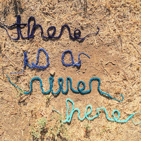 There Is A River Here project sign created by Liz Flynn. Courtesy @thereisariverhere Instagram.