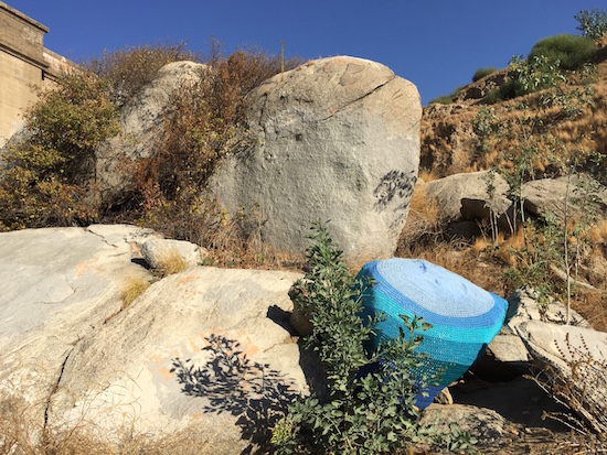 Blue ombrÃ© boulder yarnbomb. Courtesy @thereisariverhere Instagram